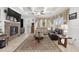 Spacious living room features stone fireplace, coffered ceiling, and large windows with elegant drapes at 4360 Sw 62Nd Loop, Ocala, FL 34474