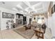 Living room features a stone fireplace, coffered ceilings, and neutral decor with a comfortable seating arrangement at 4360 Sw 62Nd Loop, Ocala, FL 34474