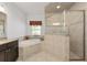 Main bathroom features include granite counters, dark cabinets, and a glass-enclosed shower at 4360 Sw 62Nd Loop, Ocala, FL 34474