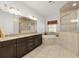 The main bathroom features dual sinks, dark cabinets, and a separate tub and shower at 4360 Sw 62Nd Loop, Ocala, FL 34474