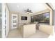 Outdoor kitchen on the patio, equipped with a built-in grill, counter space, and a ceiling fan at 4360 Sw 62Nd Loop, Ocala, FL 34474