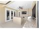 Covered patio with an outdoor kitchen, a built-in grill, and a view of the well-manicured backyard at 4360 Sw 62Nd Loop, Ocala, FL 34474