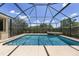 A stunning screened-in pool and spa combination offers a tranquil oasis for relaxation and enjoyment at 4360 Sw 62Nd Loop, Ocala, FL 34474