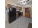 Functional kitchen with tile floors, stainless steel appliances, and ample cabinet space; great for culinary enthusiasts at 5130 Se 106 Lane, Belleview, FL 34420