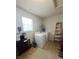 Functional laundry room with modern washer and dryer, storage shelves, and natural light at 5130 Se 106 Lane, Belleview, FL 34420