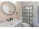 Modern bathroom featuring a vanity, mirror, toilet, and shower with black grid at 5193 Nw 61St Ave, Ocala, FL 34482