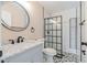 Bathroom featuring a modern vanity and a black framed glass shower enclosure at 5193 Nw 61St Ave, Ocala, FL 34482