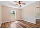 Spacious bedroom with natural light, neutral walls, and stylish flooring at 5193 Nw 61St Ave, Ocala, FL 34482