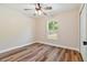 Clean, vacant bedroom features a ceiling fan and wood-look floors and neutral walls at 5193 Nw 61St Ave, Ocala, FL 34482