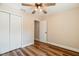 Bedroom featuring a closet and hardwood floors and a view of the door to another room at 5193 Nw 61St Ave, Ocala, FL 34482