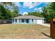 Charming blue single-story home with a well-manicured lawn and a one-car garage at 5193 Nw 61St Ave, Ocala, FL 34482