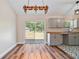 Kitchen and dining area with hardwood floors, modern cabinets and butcher block countertops at 5193 Nw 61St Ave, Ocala, FL 34482