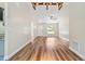 Spacious living room featuring new hard floors, modern ceiling fan, and lots of light at 5193 Nw 61St Ave, Ocala, FL 34482