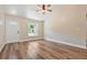 Inviting living room with new hard floors, lots of light, and ceiling fan at 5193 Nw 61St Ave, Ocala, FL 34482