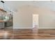 Living room view showcasing new floors, modern lighting, and an open concept kitchen at 5193 Nw 61St Ave, Ocala, FL 34482
