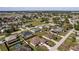 Expansive aerial view of a suburban neighborhood with well-maintained homes and green spaces on a sunny day at 5920 Sw 88Th Pl, Ocala, FL 34476