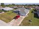 Aerial view of charming single-story home with well-manicured lawn and attached two car garage at 5920 Sw 88Th Pl, Ocala, FL 34476