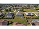 Aerial view features homes with green spaces and clear streets, ideal for tranquil suburban living with privacy and accessibility at 5920 Sw 88Th Pl, Ocala, FL 34476