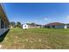 Large backyard featuring ample green space with a storage shed at 5920 Sw 88Th Pl, Ocala, FL 34476