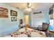 This bedroom features a ceiling fan, wood floors, and a closet at 5920 Sw 88Th Pl, Ocala, FL 34476