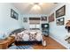 This bedroom offers neutral walls, a ceiling fan and wood floors at 5920 Sw 88Th Pl, Ocala, FL 34476