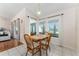 Cozy dining area features wood furniture and ample natural light with views of the exterior patio at 5920 Sw 88Th Pl, Ocala, FL 34476