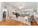 Bright living area with wood floors, vaulted ceilings, neutral colors, and an open layout perfect for entertaining at 5920 Sw 88Th Pl, Ocala, FL 34476