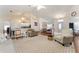 Inviting living area with vaulted ceilings, an open floor plan to the kitchen, and comfortable seating at 5920 Sw 88Th Pl, Ocala, FL 34476