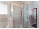 This bathroom features a glass shower with built-in shelving and a separate tub at 5920 Sw 88Th Pl, Ocala, FL 34476