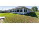 Sunroom with many windows and a door that lets you enjoy the beauty of the outdoors at 5920 Sw 88Th Pl, Ocala, FL 34476