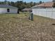 This large grassy backyard has a partially fenced yard and offers plenty of room for outdoor activities at 6 Bahia Trace Loop, Ocala, FL 34472