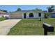 Charming single-story home with a well-maintained lawn and an attached one car garage at 6 Bahia Trace Loop, Ocala, FL 34472