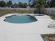 This backyard features an in-ground pool with a jacuzzi, surrounded by a patio, perfect for relaxation at 6 Bahia Trace Loop, Ocala, FL 34472