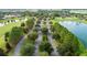 Scenic aerial view of a community with lush landscaping, water features, and walking trails at 6046 Sw 86Th Cir, Ocala, FL 34481