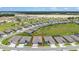 Aerial view of a neighborhood featuring well-maintained homes and a large development at 6046 Sw 86Th Cir, Ocala, FL 34481