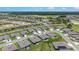 New homes in a well-planned community feature manicured lawns and mature landscaping at 6046 Sw 86Th Cir, Ocala, FL 34481