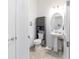 Cozy bathroom featuring modern fixtures, a gray storage cabinet and a pedestal sink at 6046 Sw 86Th Cir, Ocala, FL 34481