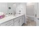 Modern bathroom with white vanity, quartz countertops, and tile flooring at 6046 Sw 86Th Cir, Ocala, FL 34481