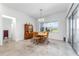 Dining area with views of the outdoors features light fixture and wooden table at 6046 Sw 86Th Cir, Ocala, FL 34481