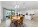 Dining area that overlooks living and kitchen area and leads out to a patio at 6046 Sw 86Th Cir, Ocala, FL 34481