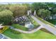 Aerial view of community entrance with pond, waterfall, and lush landscaping at 6046 Sw 86Th Cir, Ocala, FL 34481
