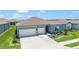 A stunning aerial view of the residence showcasing its manicured lawn, complementing neighborhood, and well-maintained surroundings at 6046 Sw 86Th Cir, Ocala, FL 34481