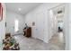 Elegant foyer featuring tile flooring and a decorative organ, creating a warm and inviting entrance at 6046 Sw 86Th Cir, Ocala, FL 34481