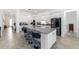 Expansive kitchen island with bar seating; stainless appliances, bright and modern with great open flow at 6046 Sw 86Th Cir, Ocala, FL 34481