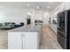 Kitchen view showcasing a large island with a granite countertop, stainless appliances and open floorplan at 6046 Sw 86Th Cir, Ocala, FL 34481