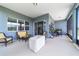 Relaxing lanai area with stylish wicker furniture and view of the property at 6046 Sw 86Th Cir, Ocala, FL 34481