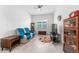 Bright living room featuring tile floors, ceiling fan, sitting area with blue accents and nice furnishings at 6046 Sw 86Th Cir, Ocala, FL 34481