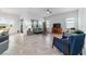 Bright living space featuring tile floors, neutral walls, large windows, and comfortable seating, perfect for relaxation at 6046 Sw 86Th Cir, Ocala, FL 34481