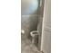 This bathroom features a toilet and tiled walls at 6051 Ne 25Th Ave, Ocala, FL 34479