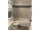 Bathroom features a tub and a toilet at 6051 Ne 25Th Ave, Ocala, FL 34479